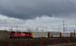 trailing DPU, CP 7040 with a unit autrack train slowly pulling into the PoCo Intermodal yar.